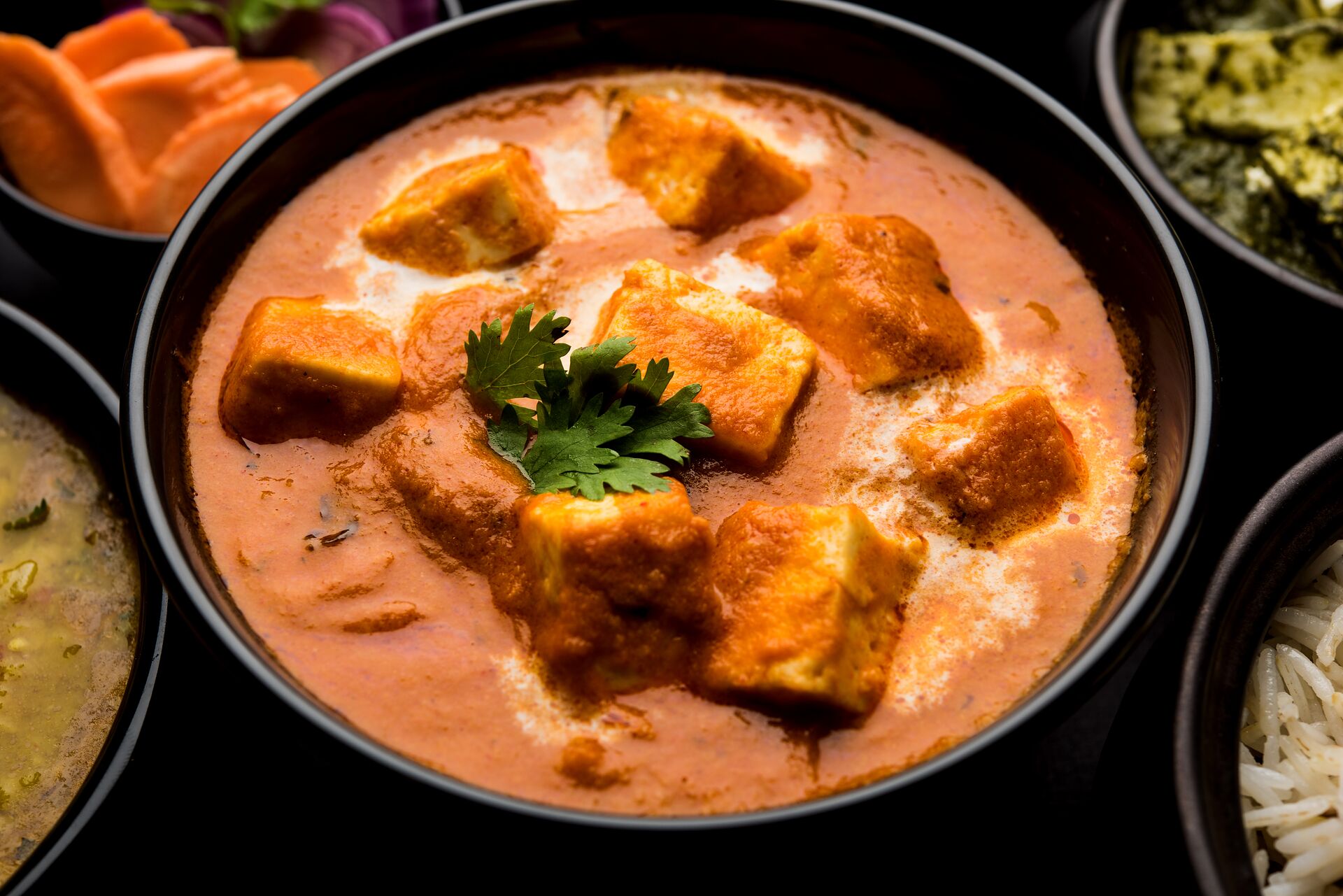 Paneer butter masala with dal, palak paneer, basmati rice and salad at Nawab